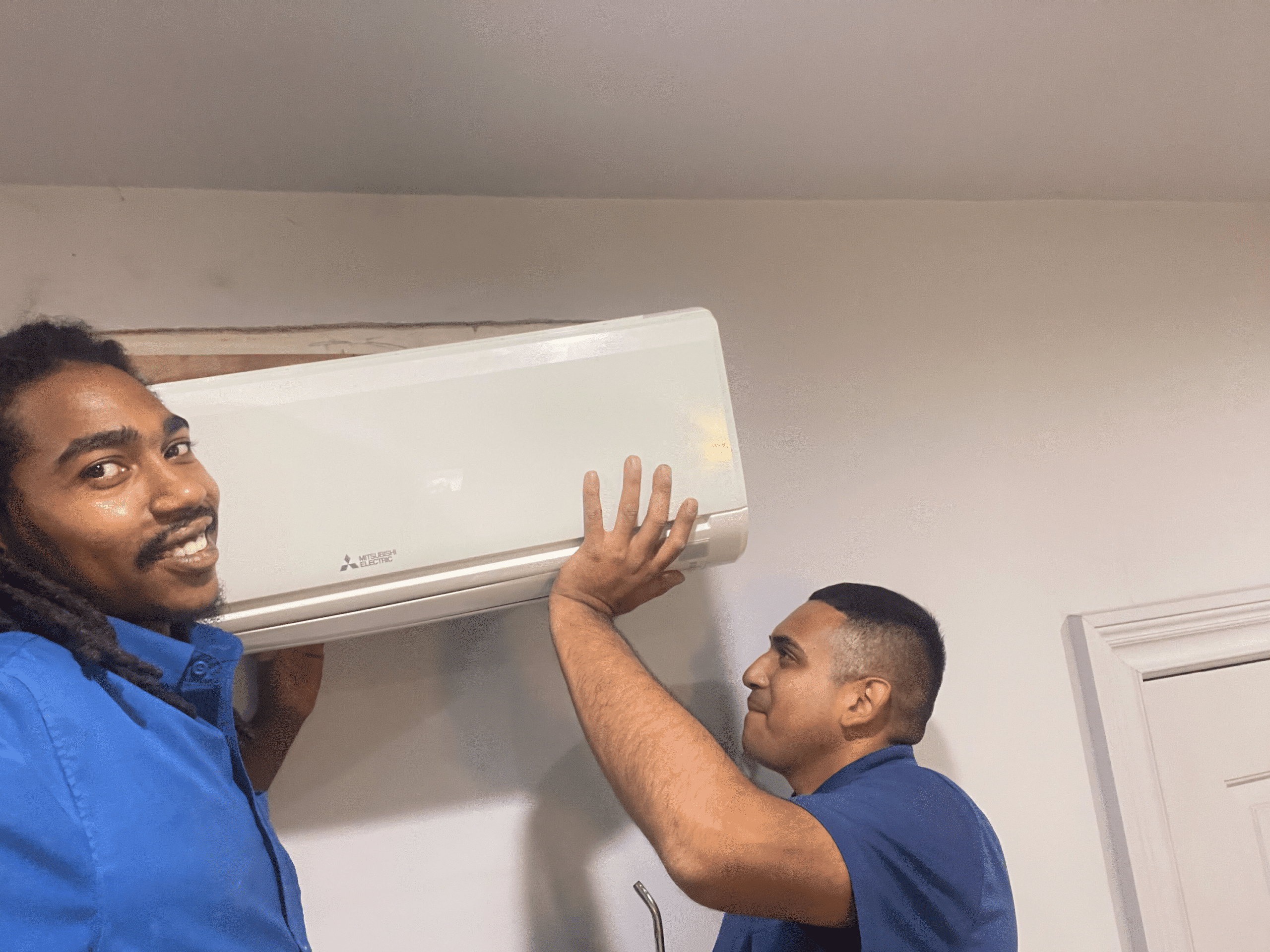 Petri techs installing AC in Brooklyn