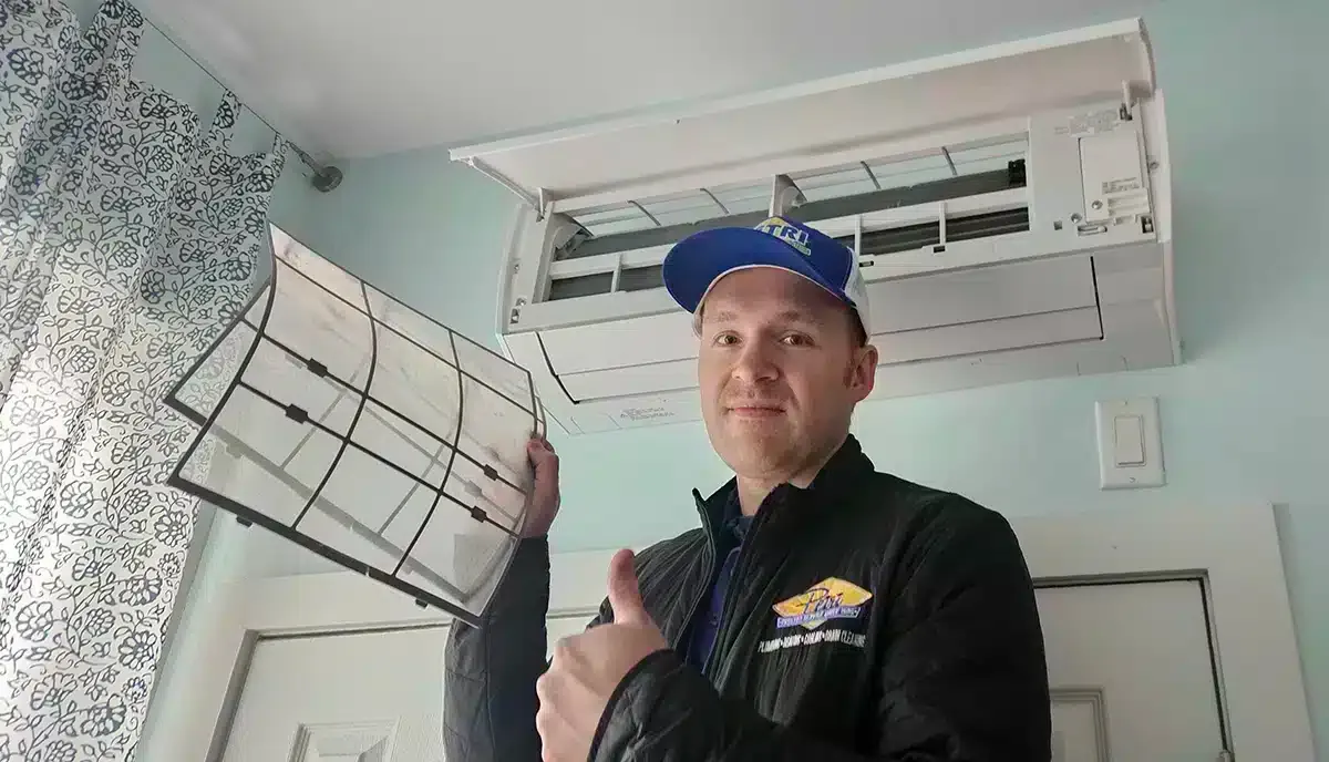 A Petri Technician replacing filters in an HVAC unit in Brooklyn, NY.