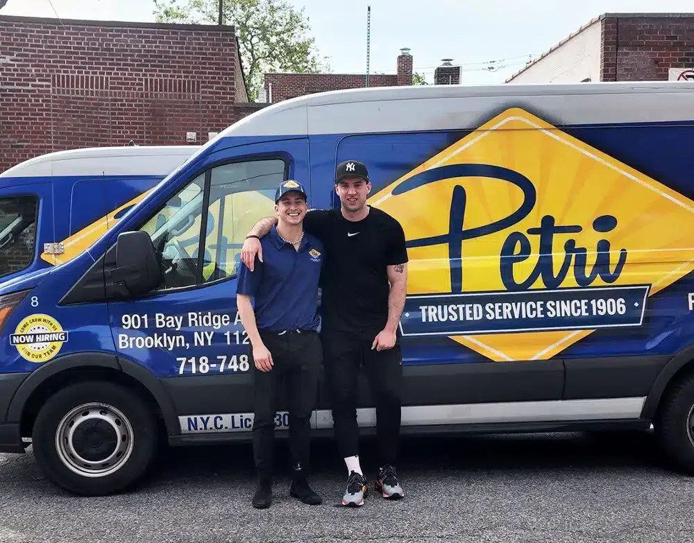 Brooklyn plumber from Petri in front of van