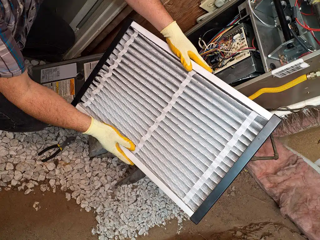 filter being replaced as part of heating maintenance in brooklyn ny