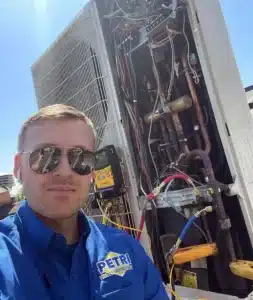 A Petri Technician performing maintenance on an HVAC unit in Brooklyn, NY.