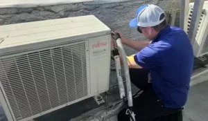 Petri Technician working on an HVAC unit in Brooklyn, NY.
