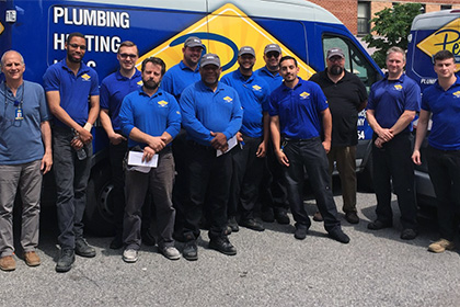 plumbers in front of plumbing van in Brooklyn or Queens NY