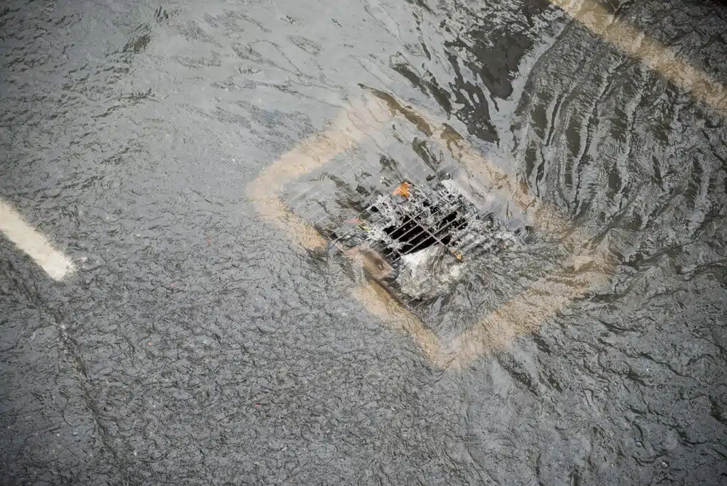 city sewer drain filling with water
